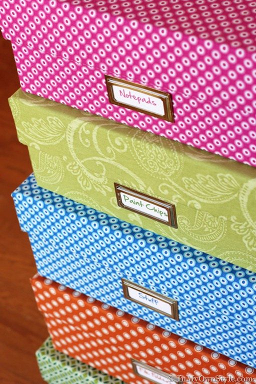 colorful stacked storage boxes in a craft room.