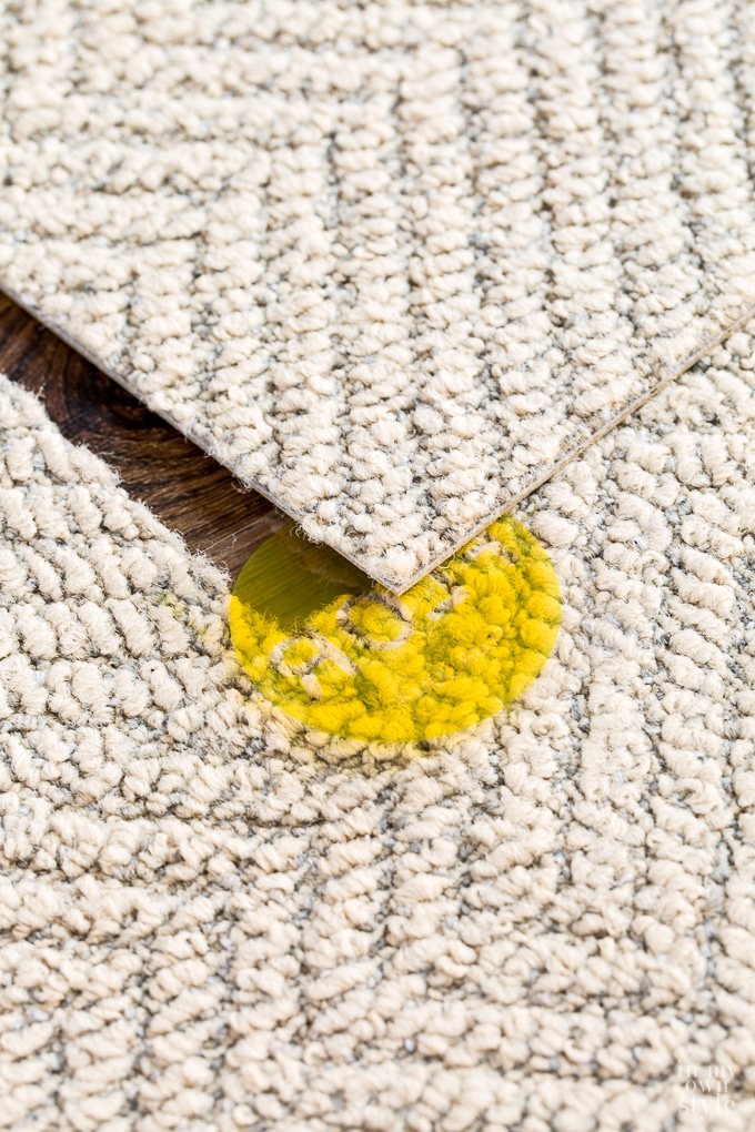 FLOR Rug being put together using separate squares that are paced together to make any size rug you need.