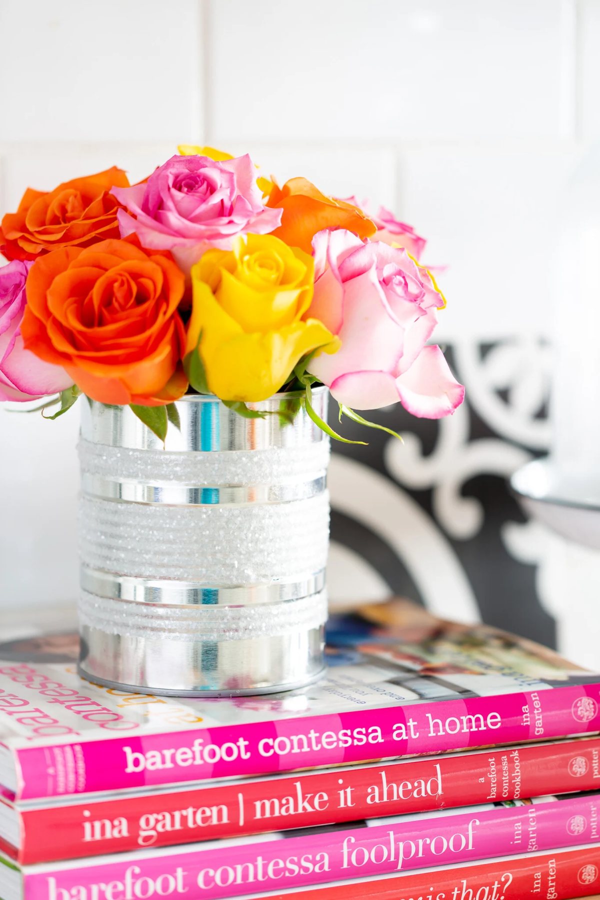 Kitchen counter styling ideas. Rainbow roses styled in a diy tin can vase on a kitchen counter.