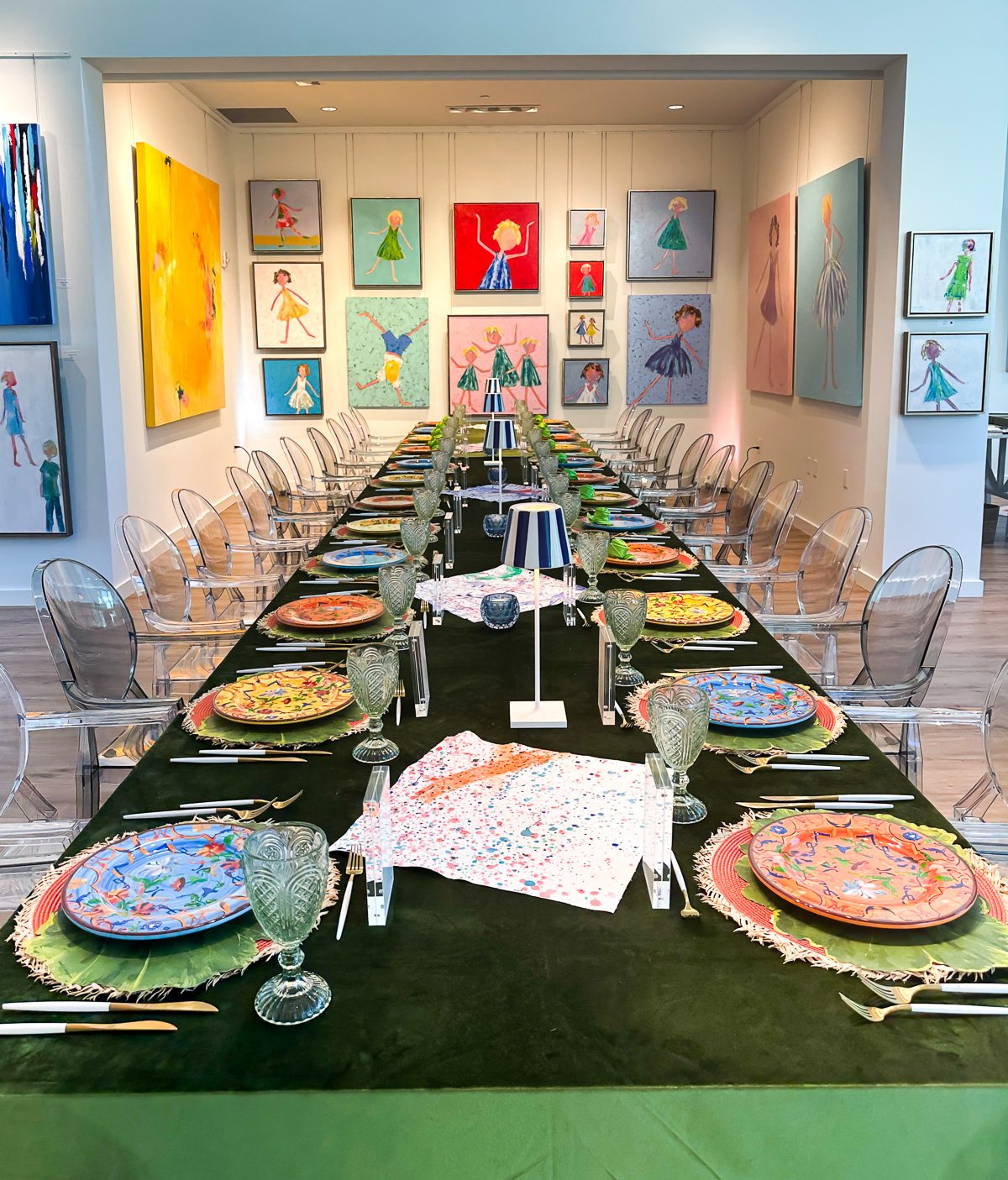 colorful table set for a charity event at an art gallery.