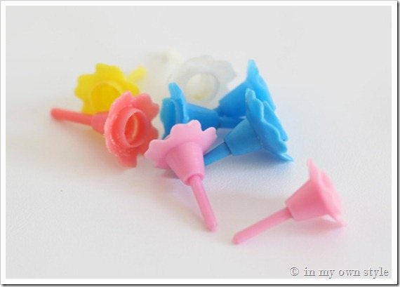 Colorful plastic birthday cake candle holders.