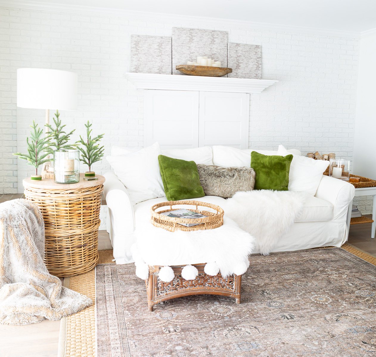 a calm and peaceful neutral decorated living room with woven and green accents