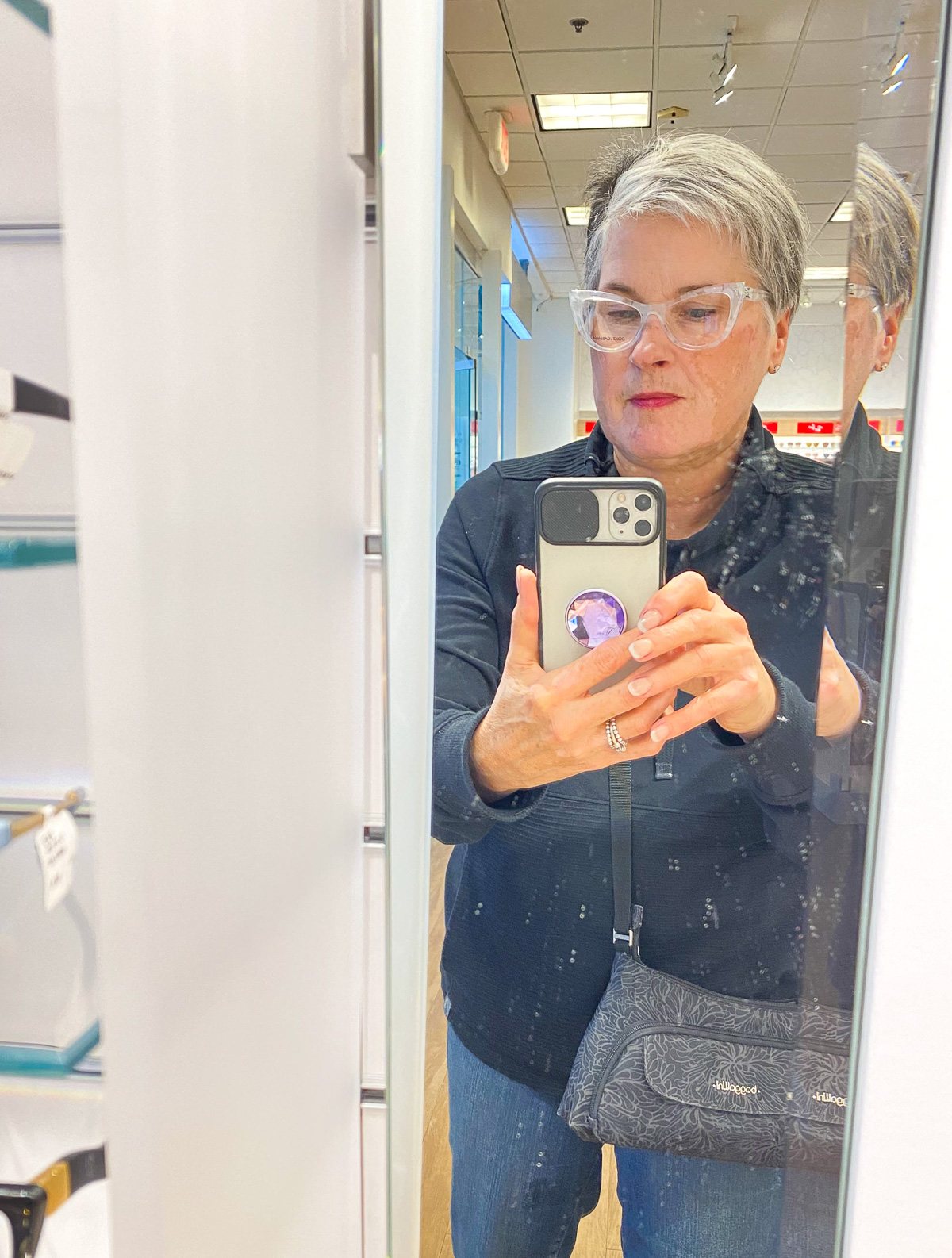Diane Oducu trying on eye glasses