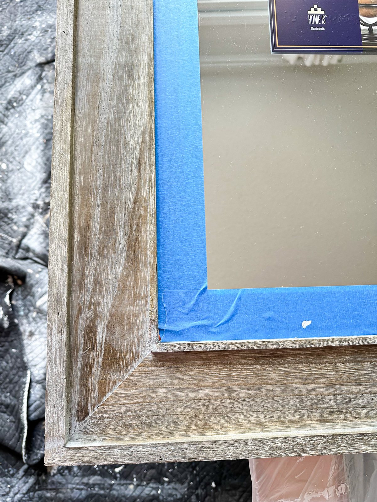 wood frame mirror with painter's tape