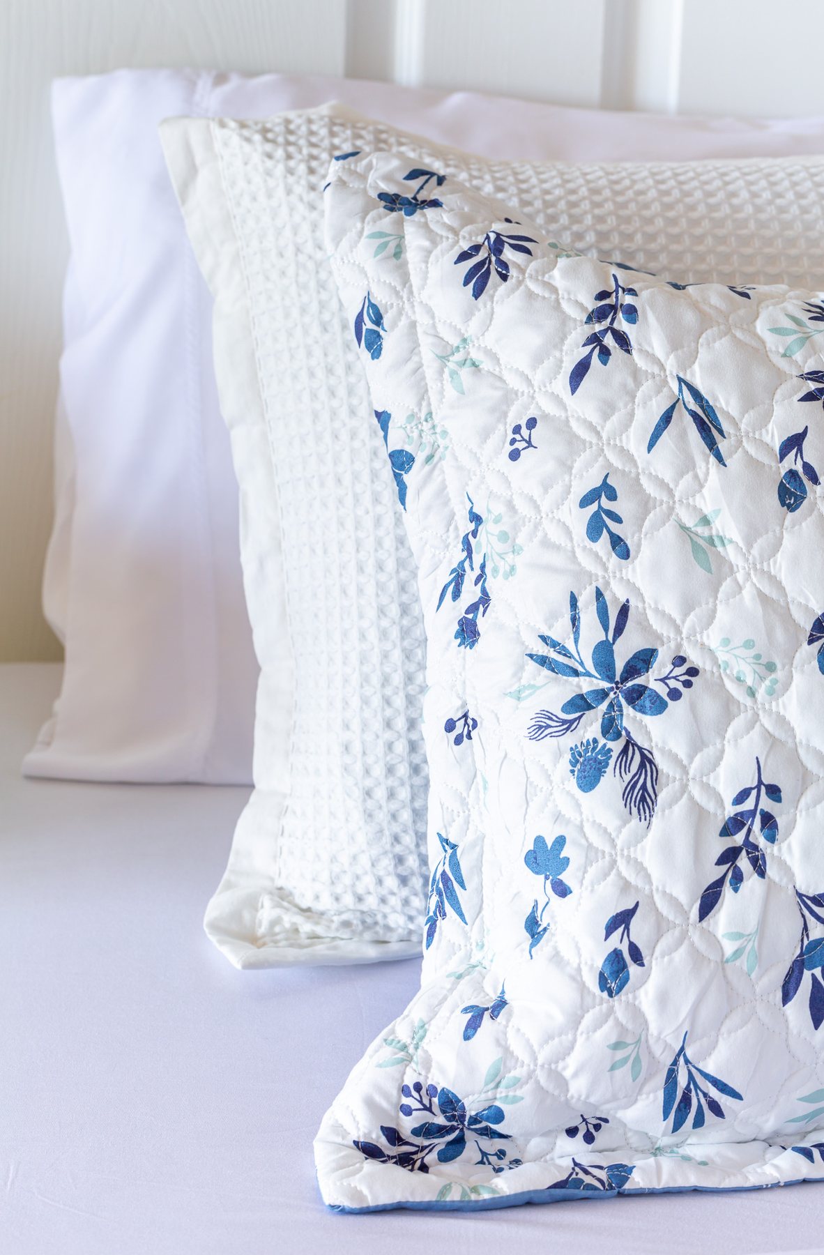 Bedsure pillows and shams on a bed with white sheets