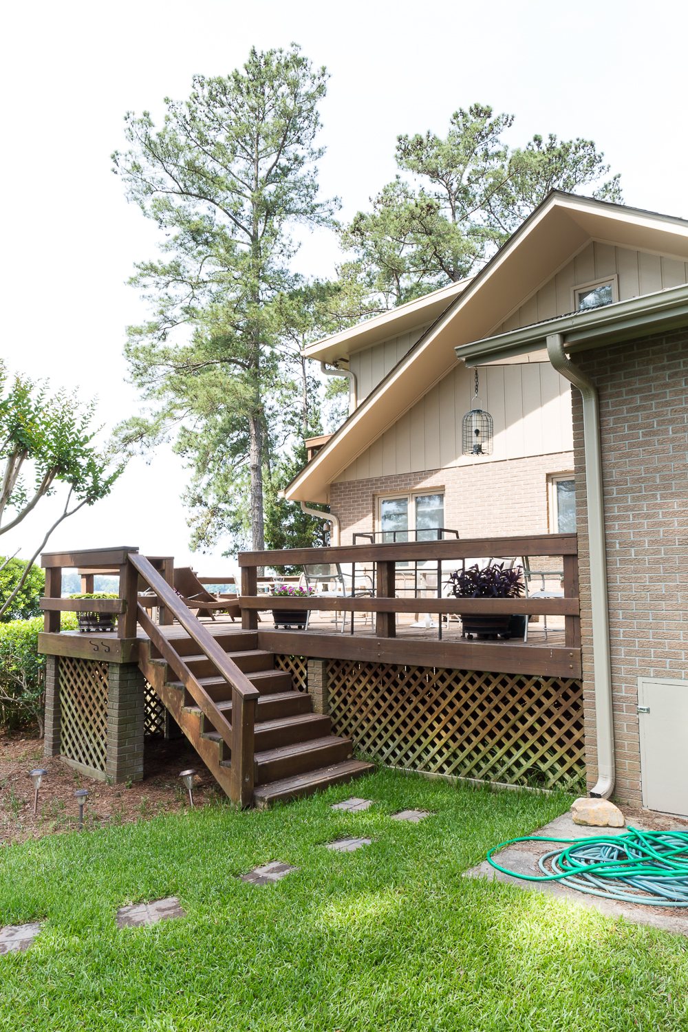 Side of house that shows the transition from Ranch style front facade to two story lake side