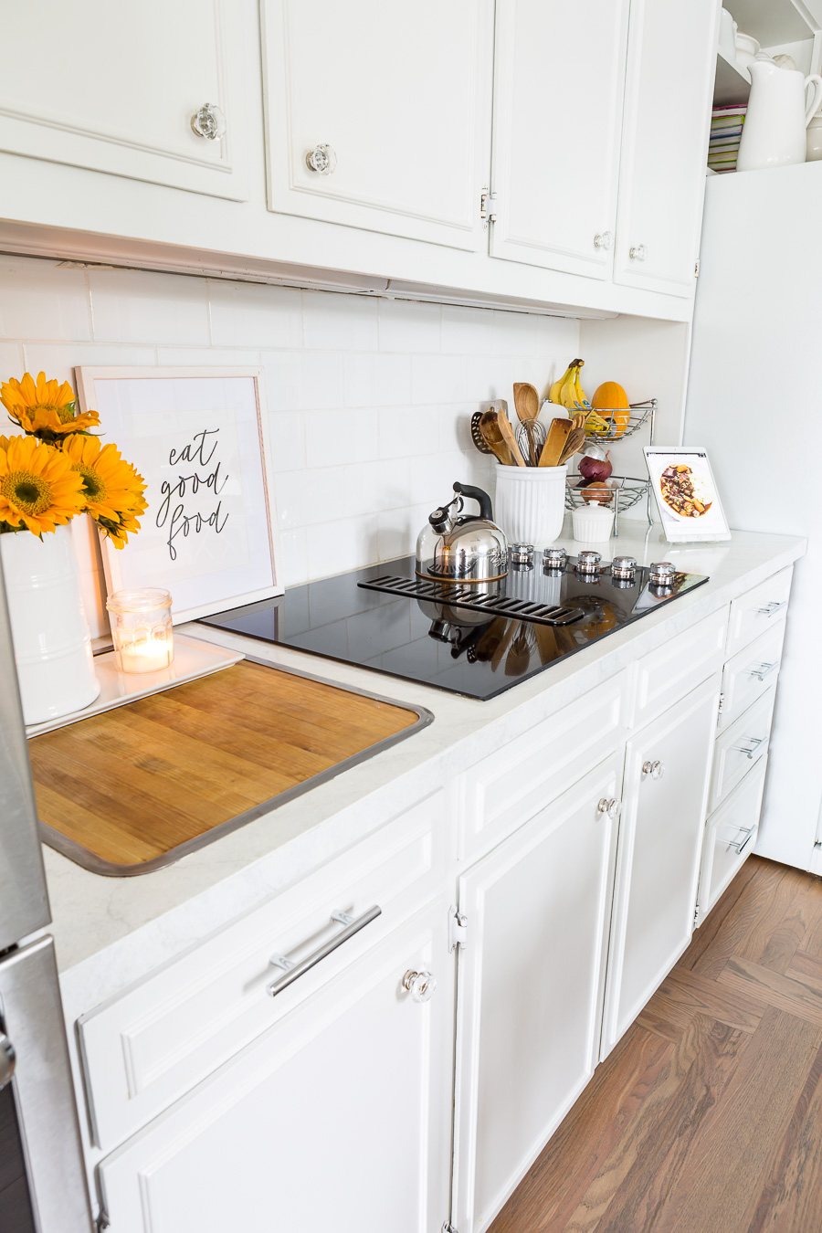 Photo of a kitchen painted white.