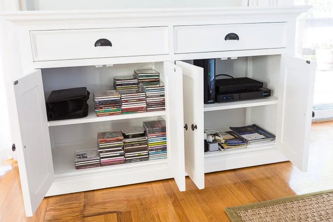 White buffet turned changed to into Tv wall mount furniture that will hold the TV components
