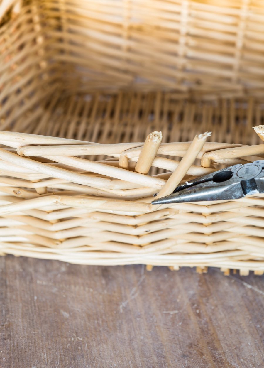 taking apart a thrift store basket so it can be used as decorative storage