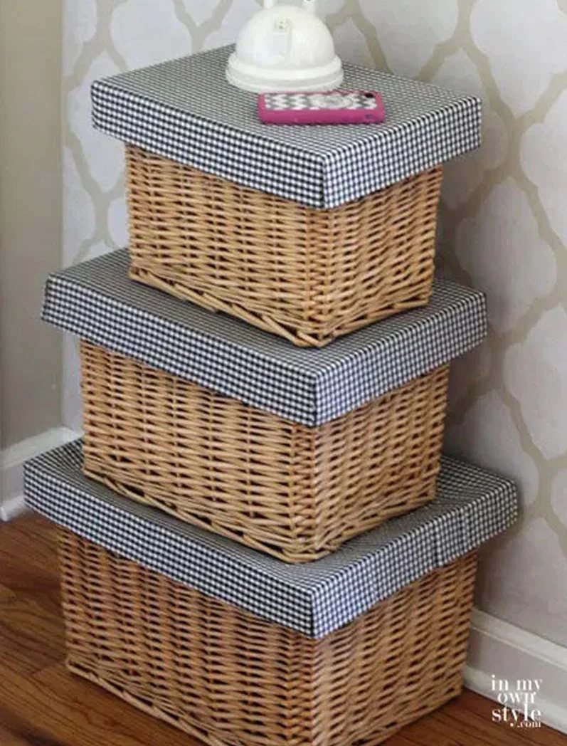 stack of three rectangular baskets with DIY made lids that allows the baskets to be stacked for organized storage.