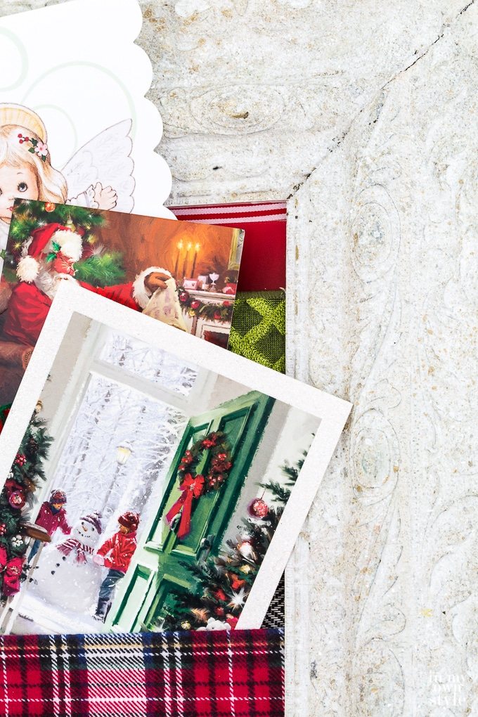 Display Christmas cards in style by making a Christmas card holder using ribbon and a frame.