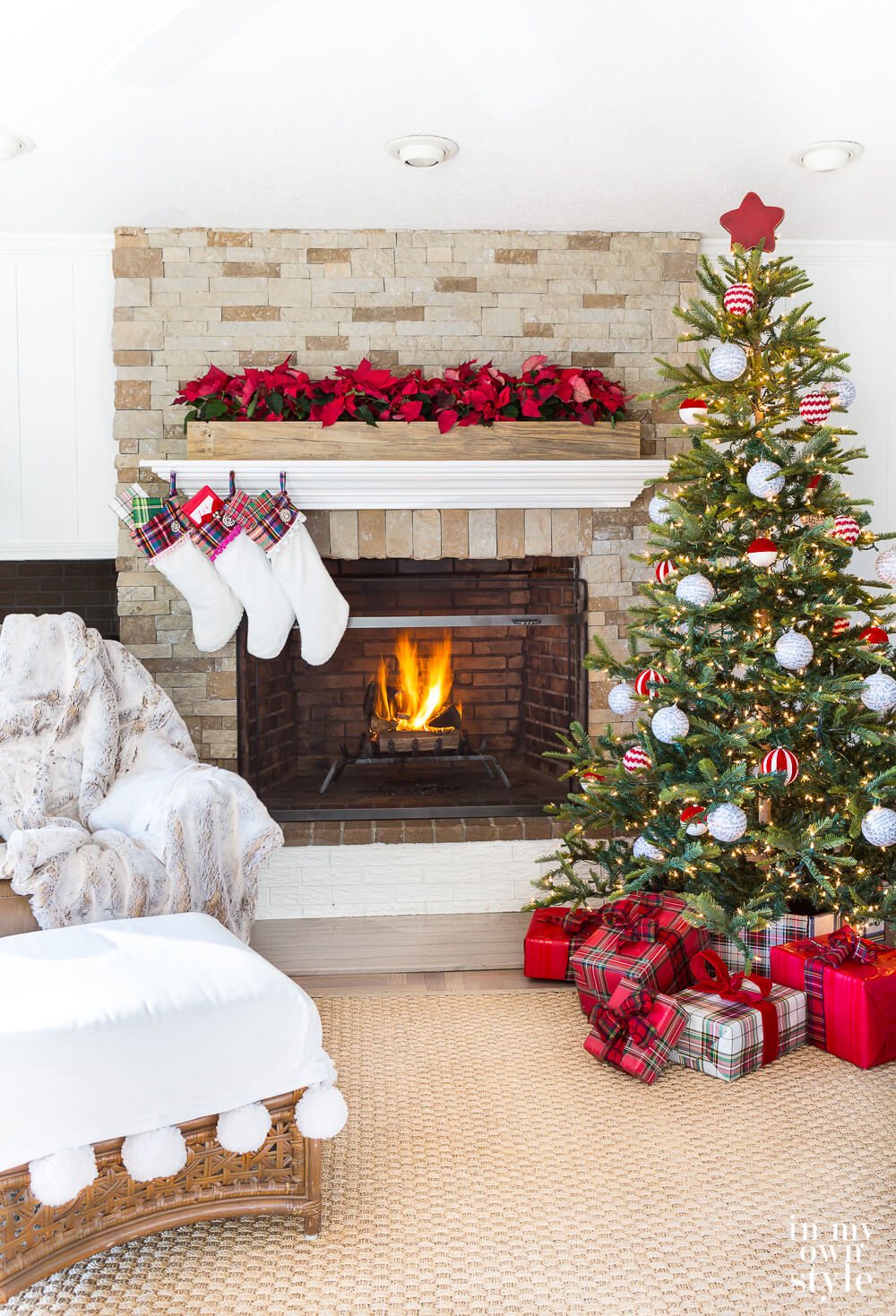 Mantel in living room decorated for Christmas