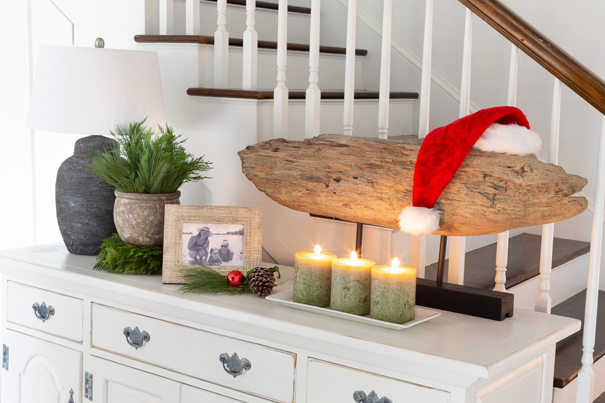 Foyer console table with modern art with santa hat