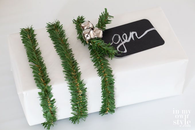Christmas gift wrap Idea using 3 garland ties on a wrapped gift box.