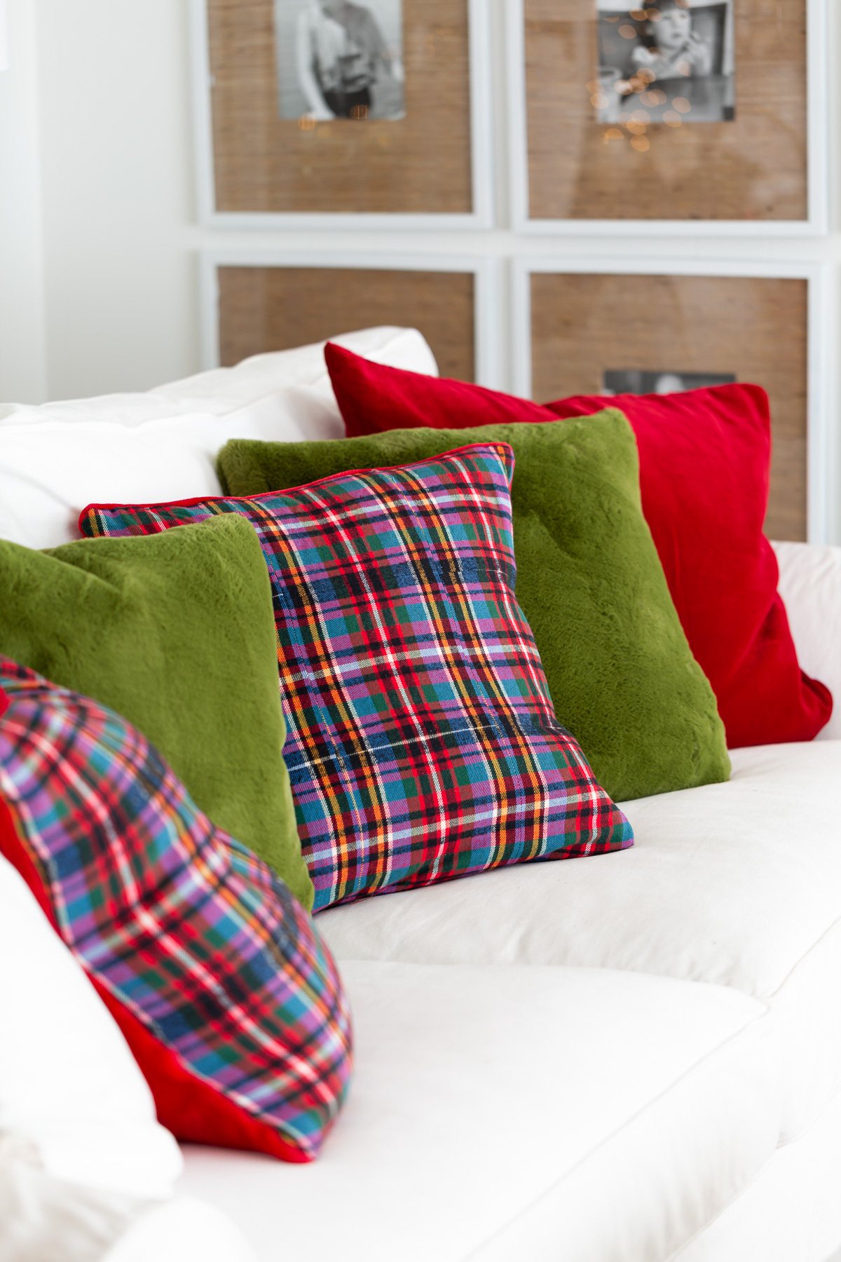red plaid holiday pillows on white sofa