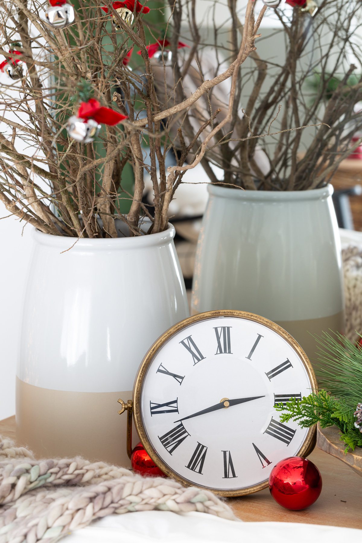 Roman numeral clock on console table
