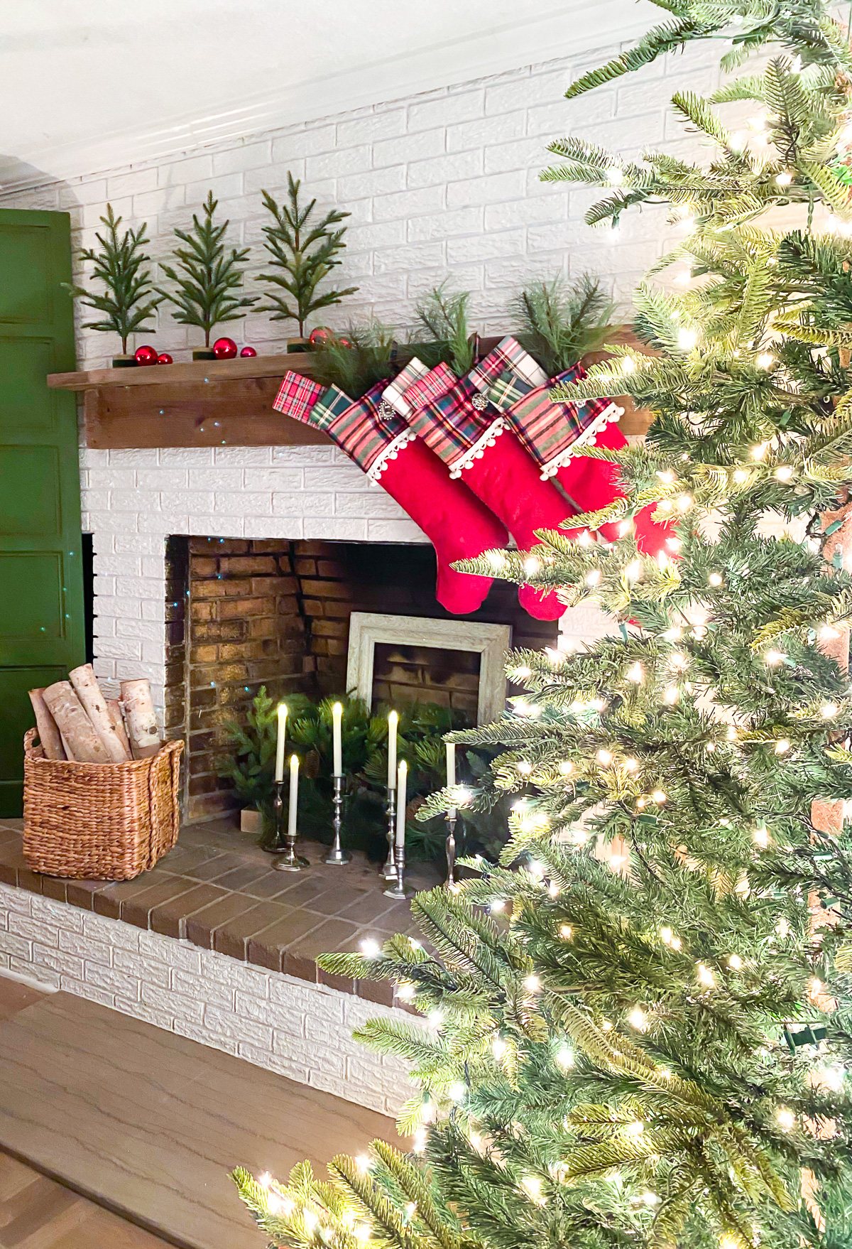 Mantel at night decorated for Christmas