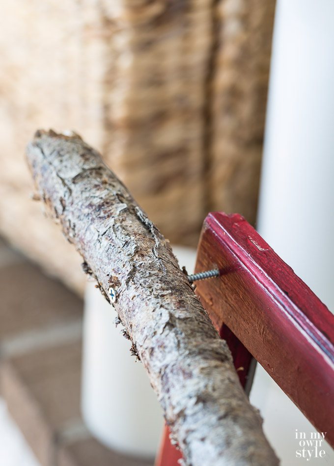How to attach a tree branch to a Christmas mantel window sash