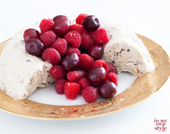 Semifreddo-with-berries on a gold rimmed plate.