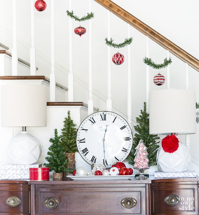Christmas Staircase Decorating Idea using Garland Ties and shatterproof ornaments.