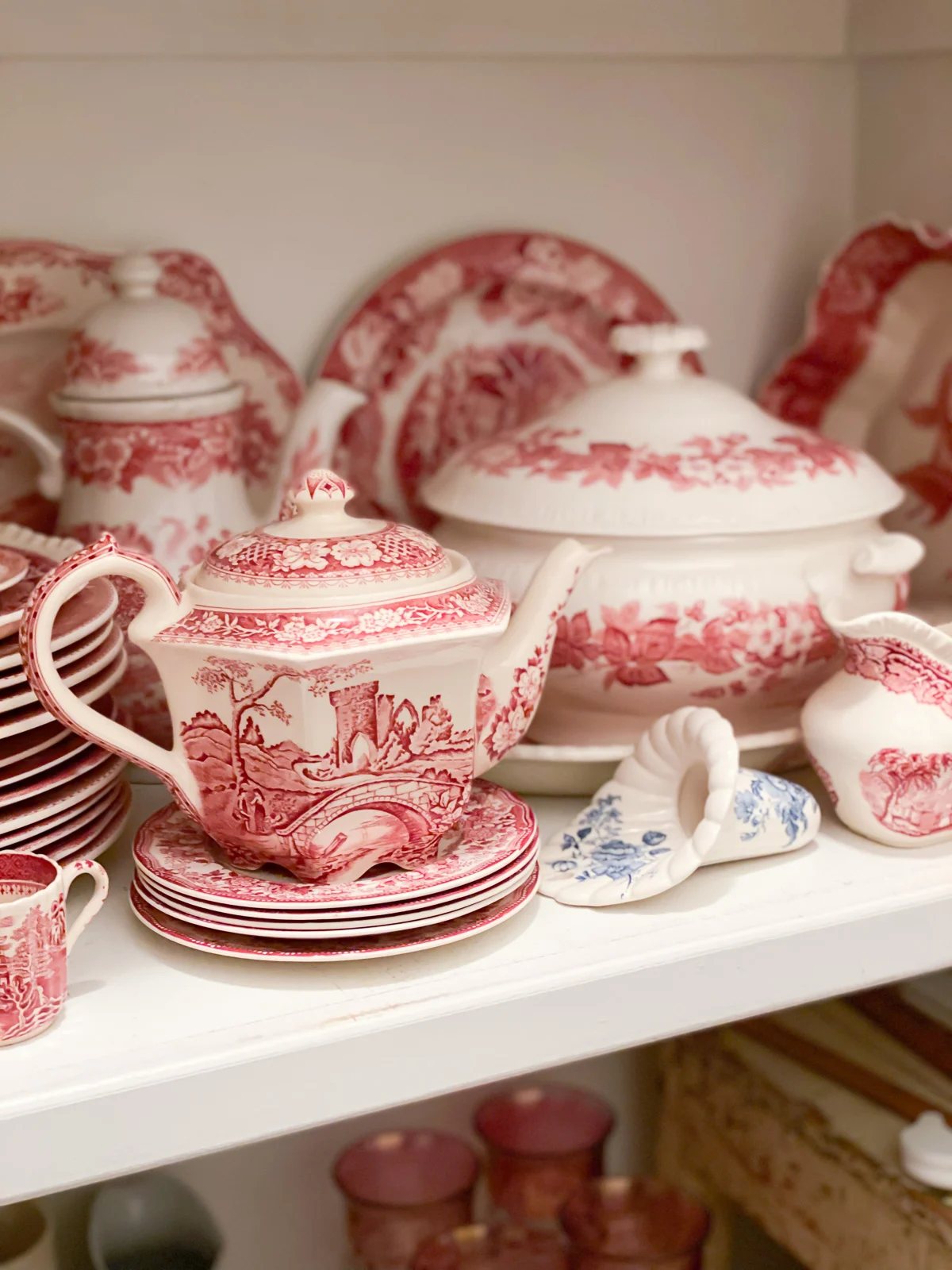 Red and white vintage china in china closet