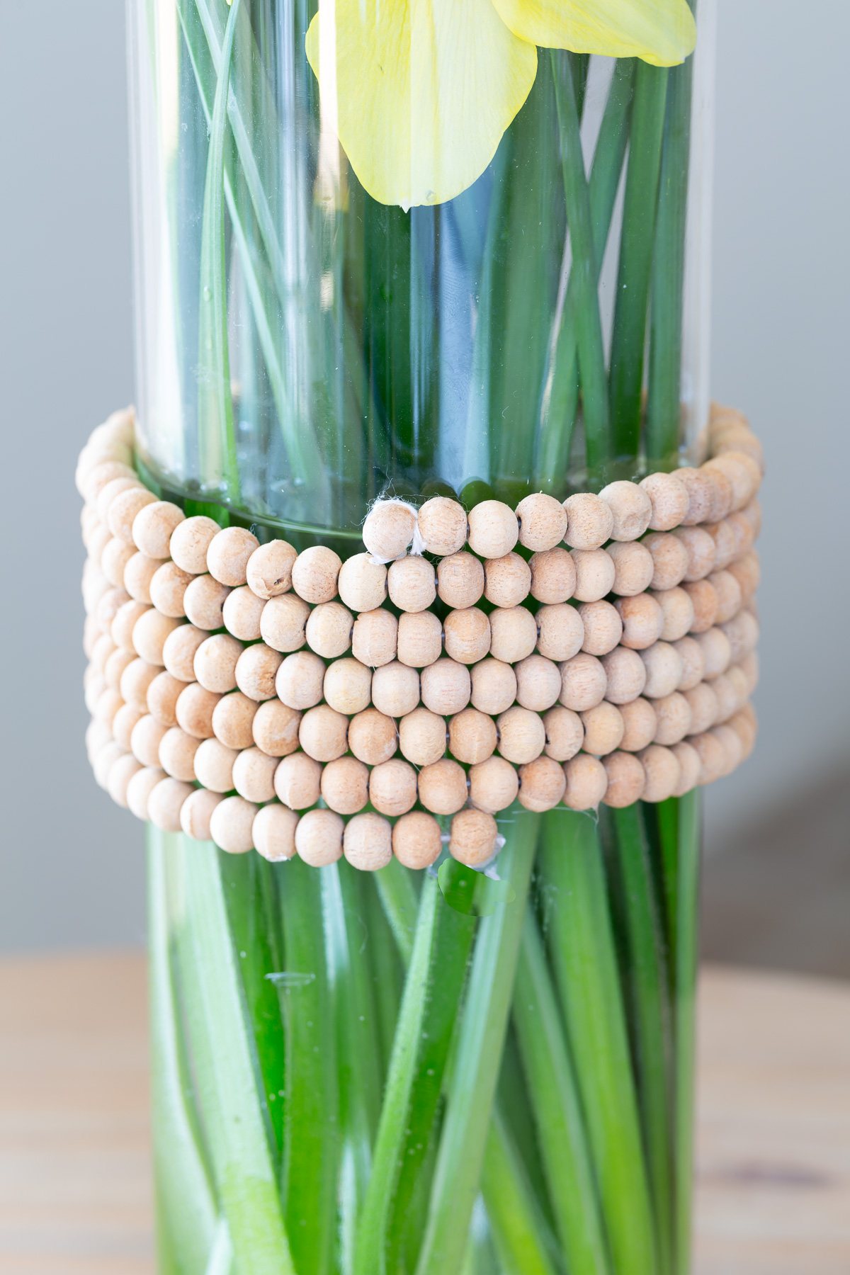 Why throw out perfectly nice bottles that condiments or liquor come in when they are empty. Why not head to your jewelry box or the thrift store to find a few pieces of old jewelry to decorate the vases from necklaces, bracelets and even clip on earrings. Don't miss all the creative old jewelry repurposing ideas.