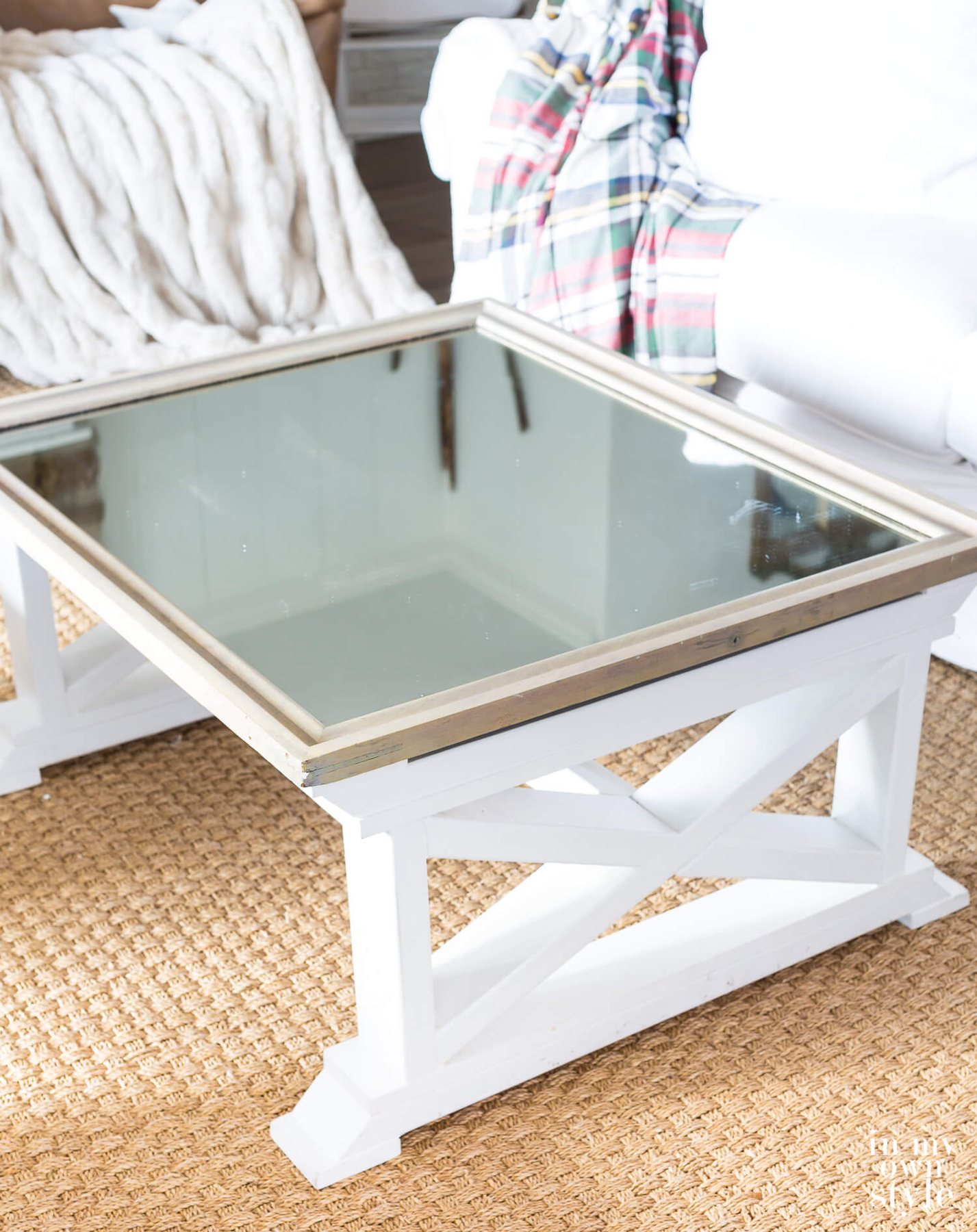 Mirrored Farmhouse coffee table with nothing on it.