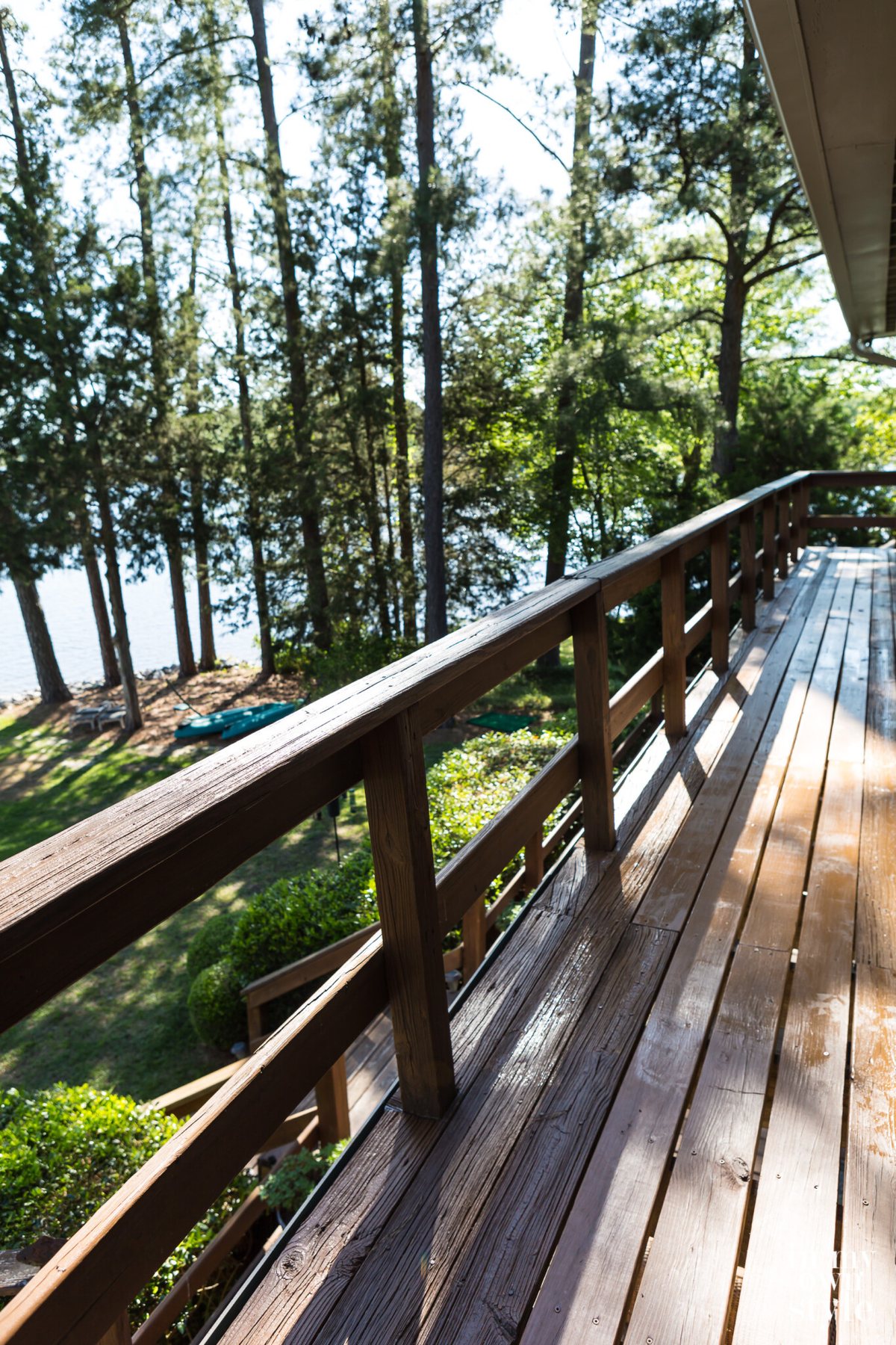 After photo showing stained wood deck.