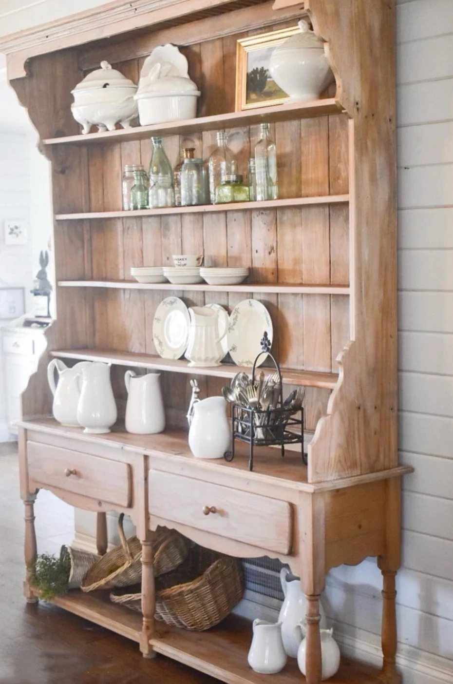 Side view of country pine hutch against shiplap wall.