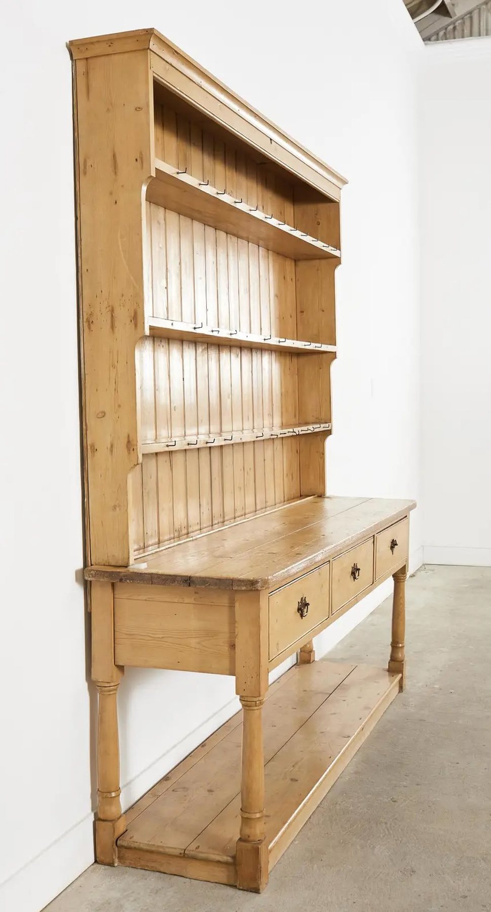 an empty Country English pine Welsh cupboard