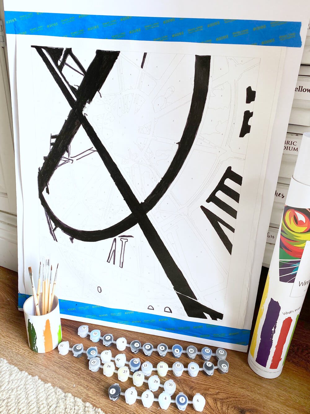 Paint by numbers mounted on foam core to make painting it easier.