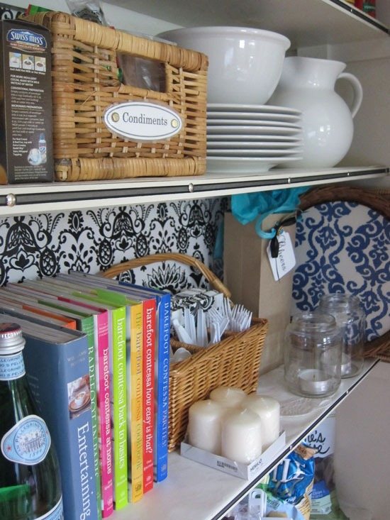 ribbon trimmed shelf edges in a pantry