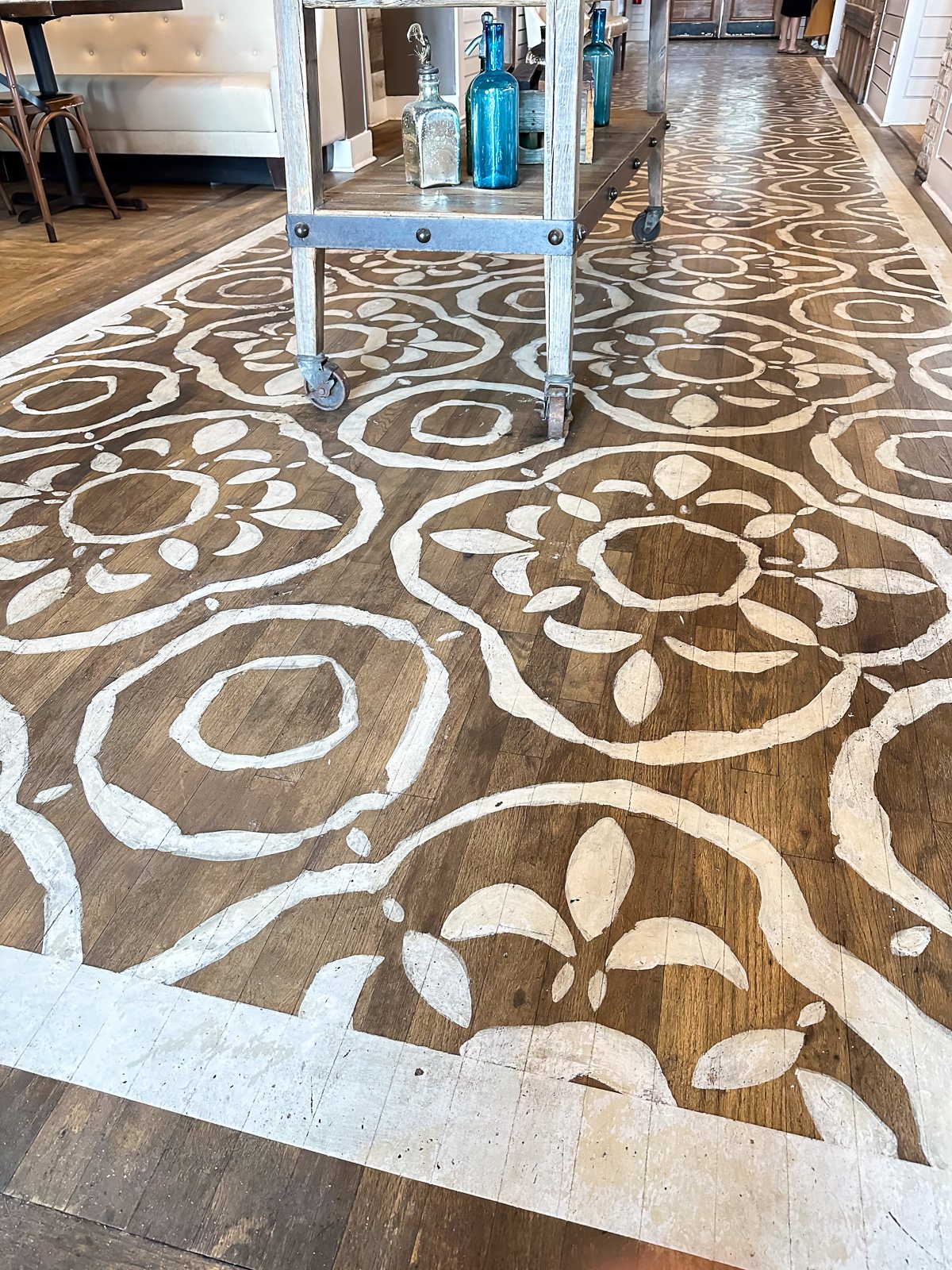 Tavern and Table restaurants stenciled wood floor.