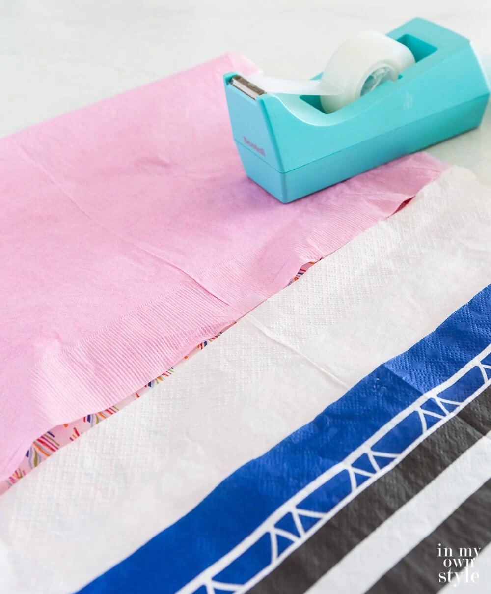 How to tape paper napkins together to make a picnic table runner.