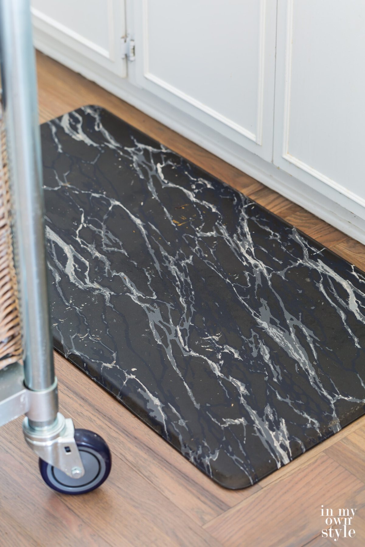 Black marble gel mat on Bona Flooring grey stained hardwood floor.