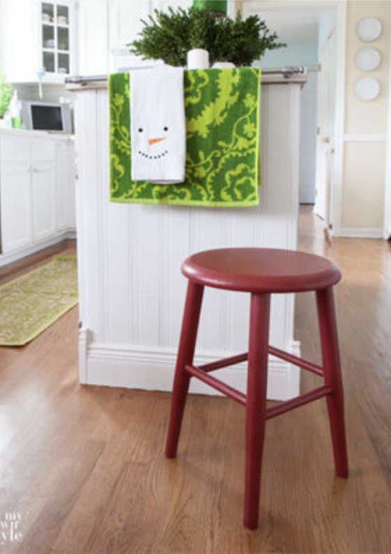 wood stool in kitchen painted red.