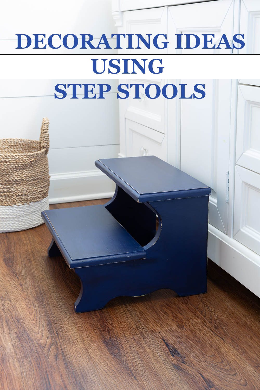Navy blue painted wood step stool placed in front of a white sink vanity in a bathroom. Text overlay says - Decorating Ideas Usind Step Stools