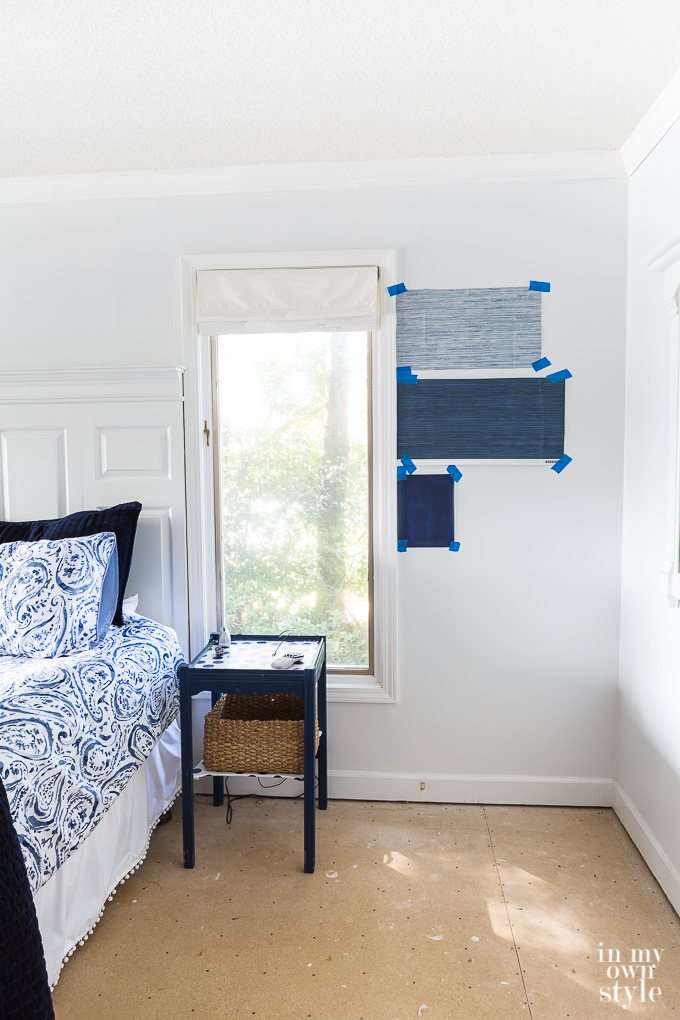 Blue and White wallpaper swatches on wall