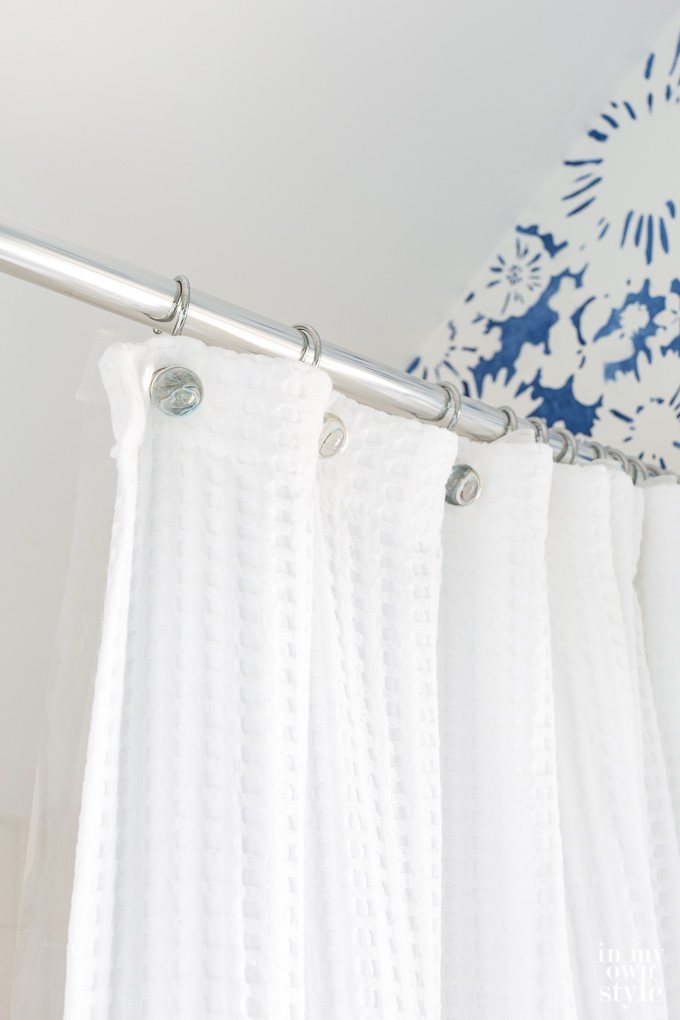 Waffle Hotel shower curtain in small bathroom