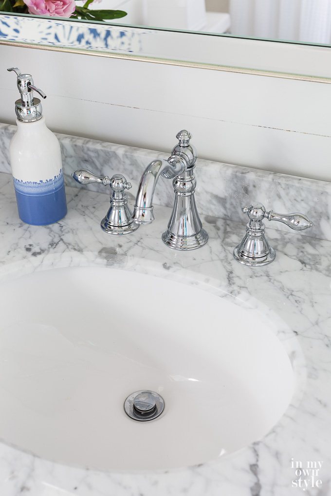 Marble topped vanity in small bathroom