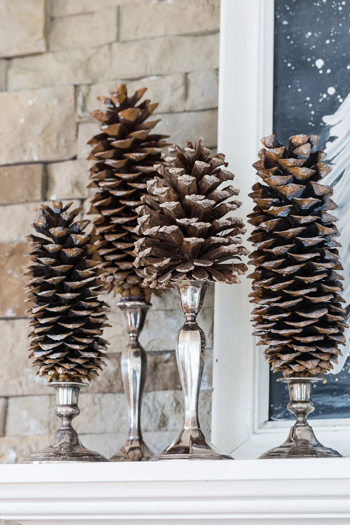 Pine cones on silver candlesticks