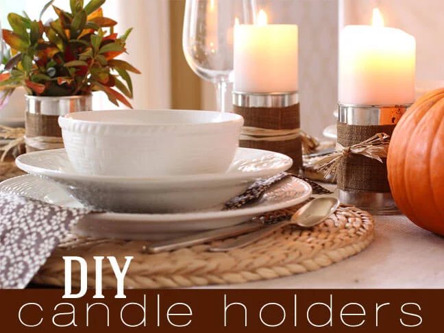 tin can and fabric candle holders on a dining table set for fall