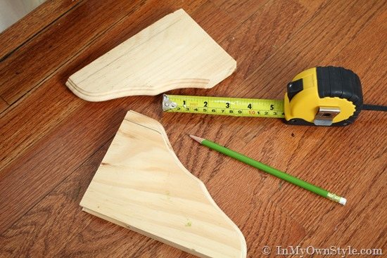 decorative wood shelf brackets made into feet to kitchen cabinets