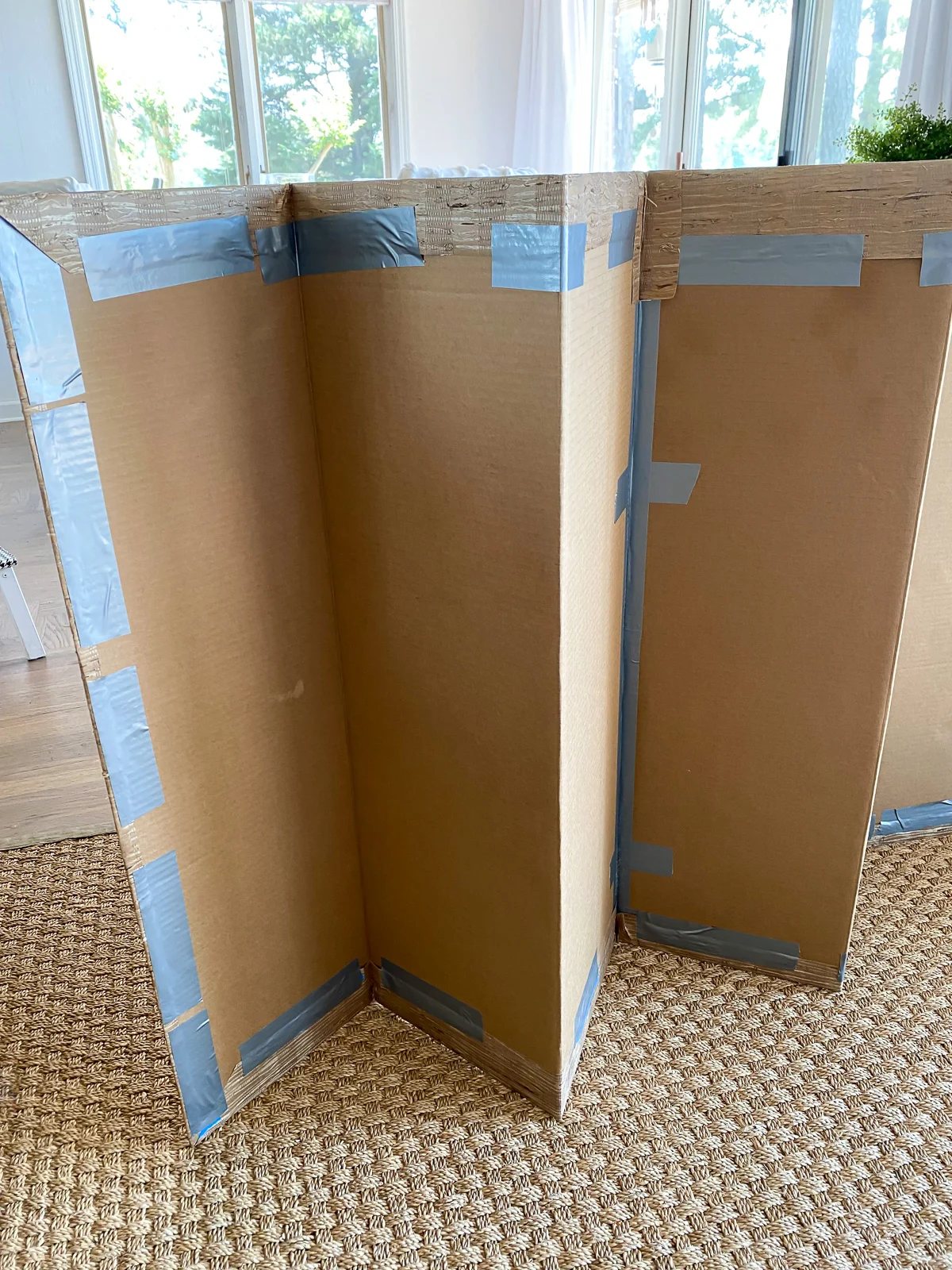 How to attach wallpaper to cardboard fireplace cover for summer.