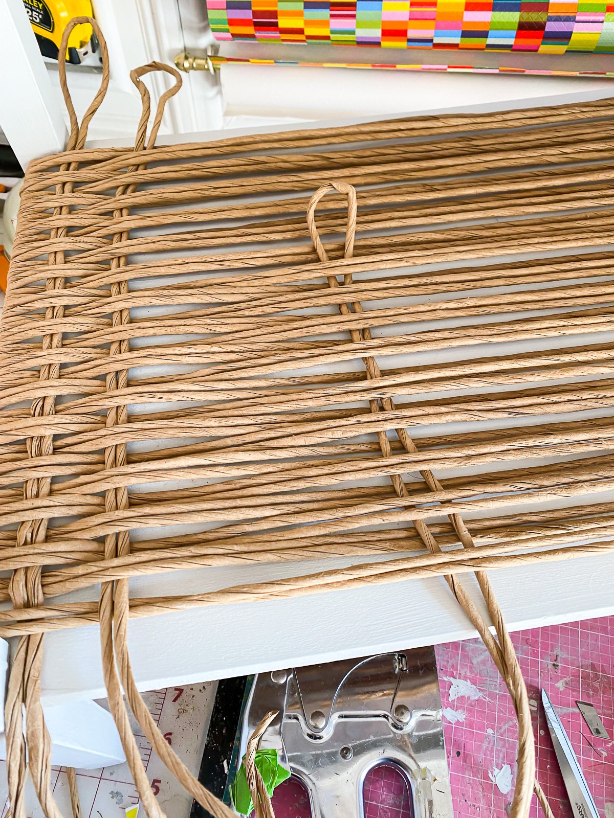 How to weave fiber rushing to create a woven effect on an end table.