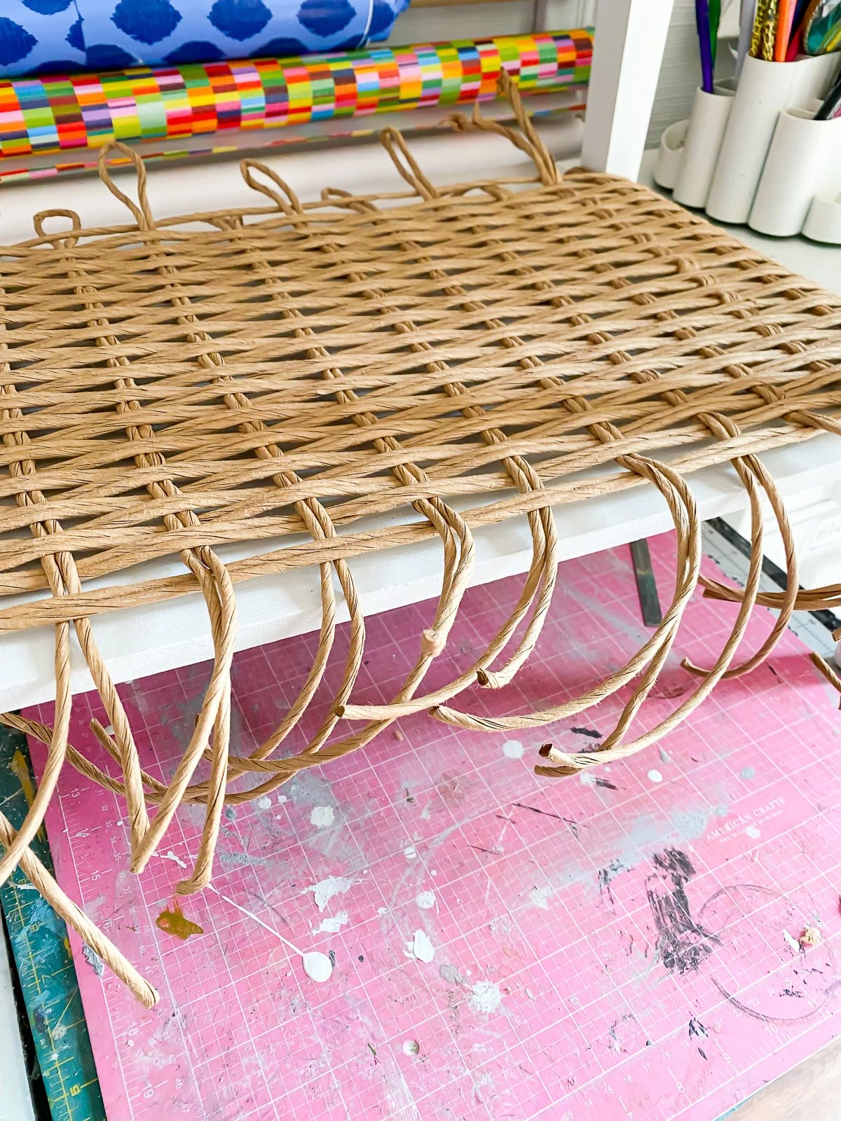 rattan fiber rush woven on table where ends are not secured under shelf.
