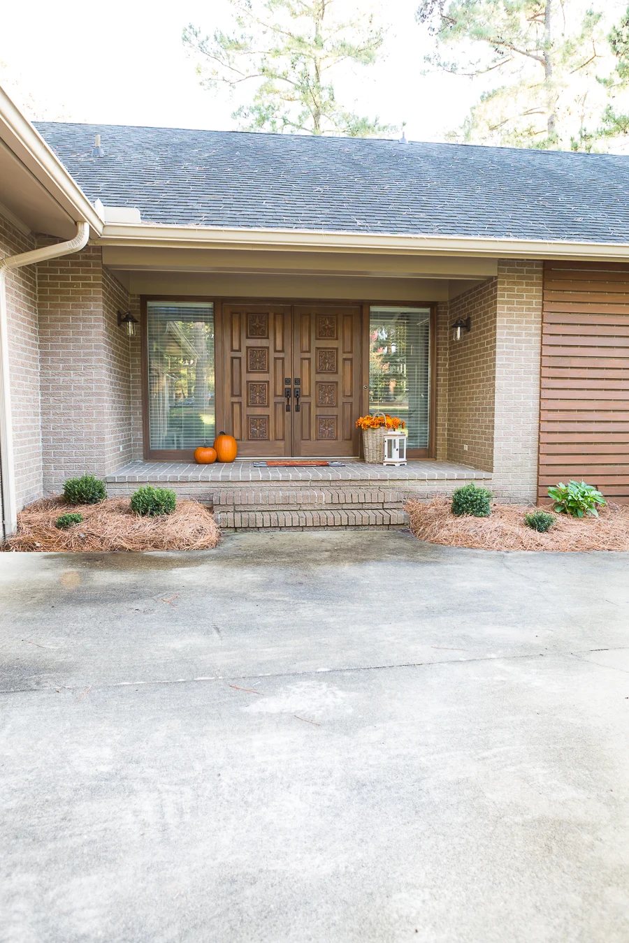 front entry of a 1970's ranch home that is getting a budget modern makeover