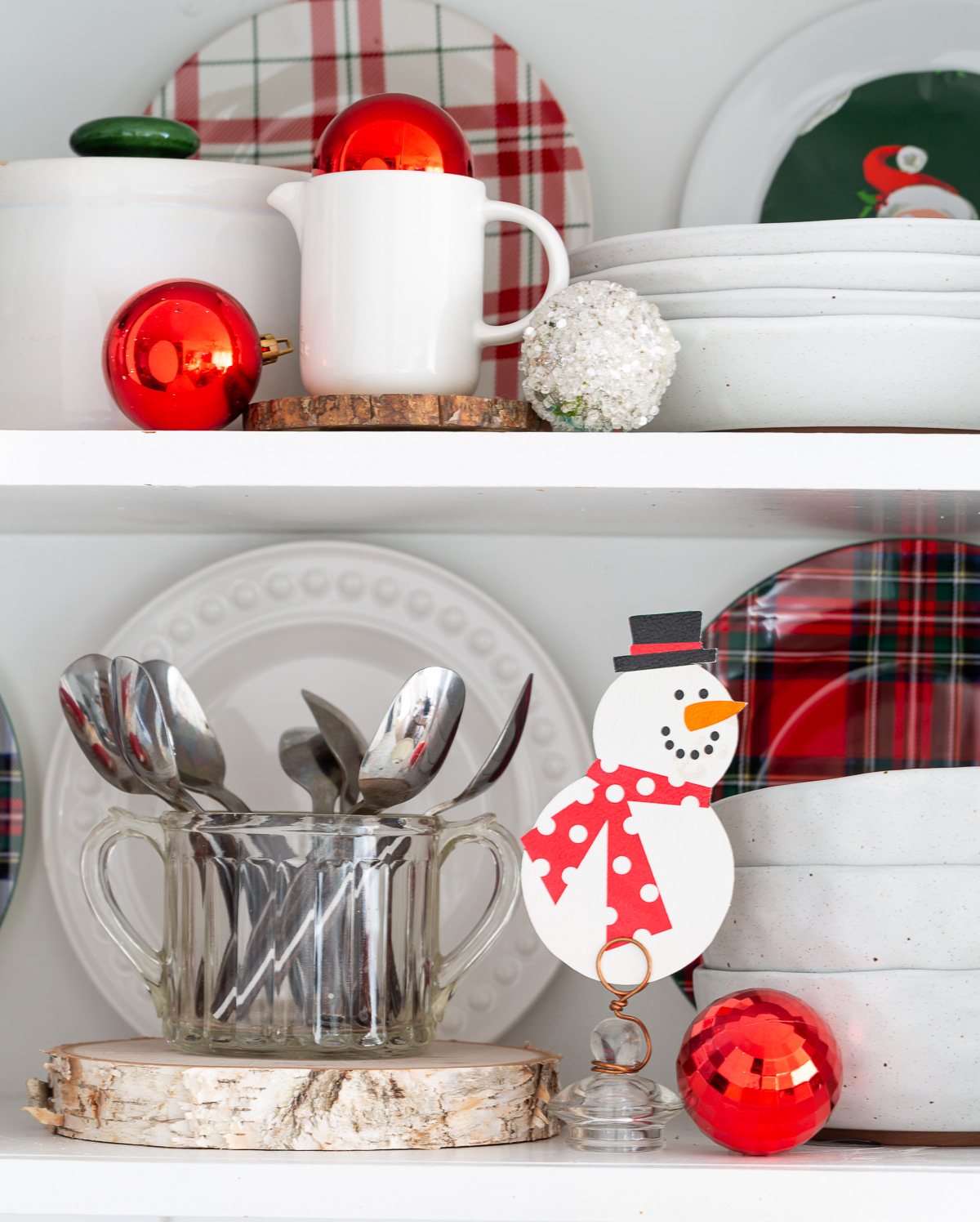 decorated shelves for Christmas using red, white and green color scheme.