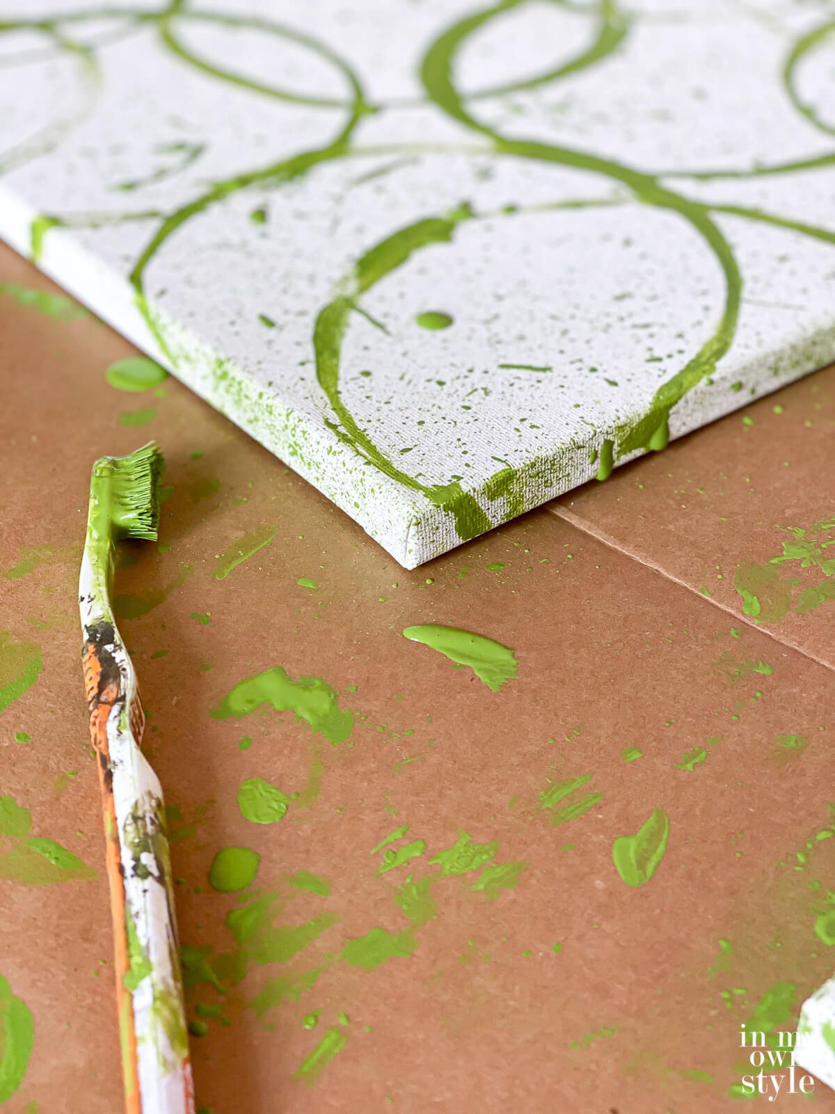 Splatter paint technique to create your own modern wall art on a canvas.