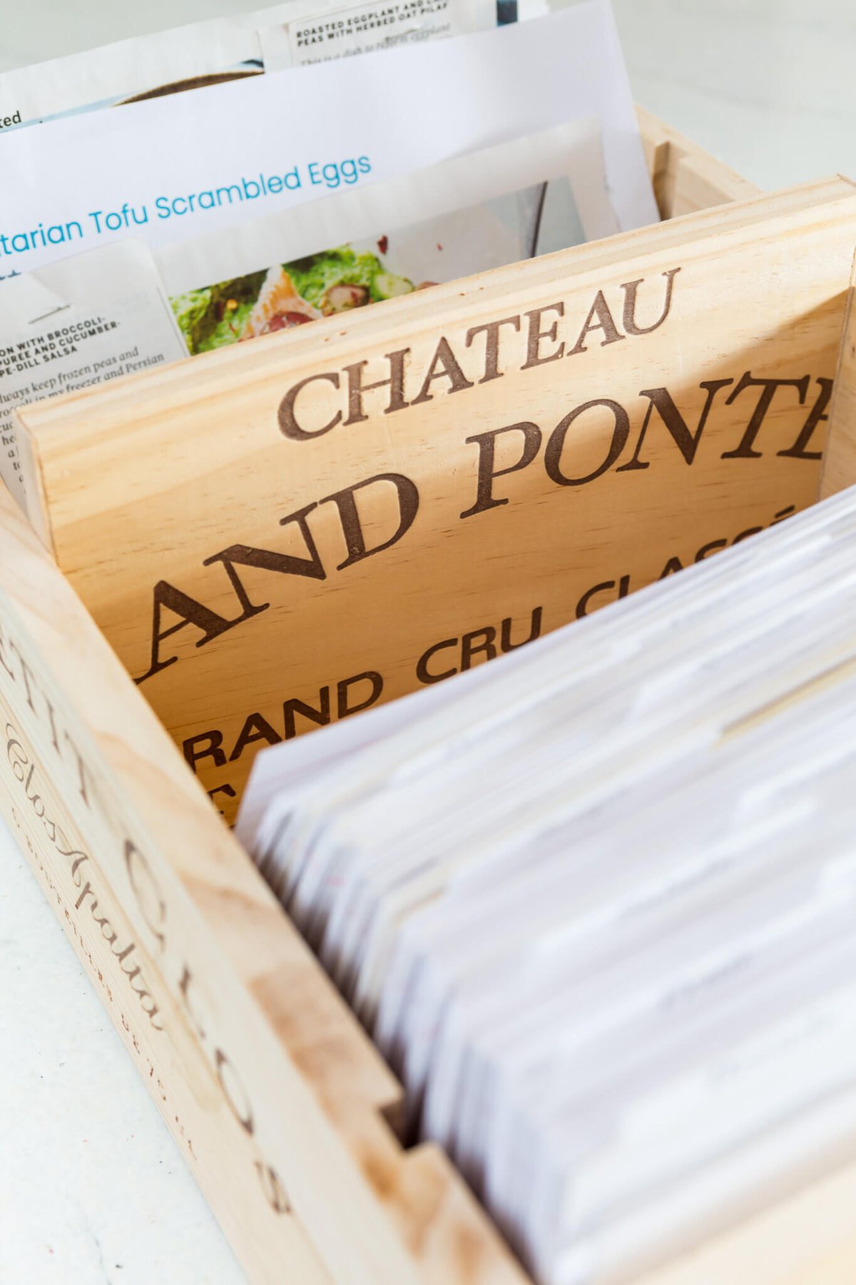 Wood wine crate front used to make a divider in a recipe card holder box.